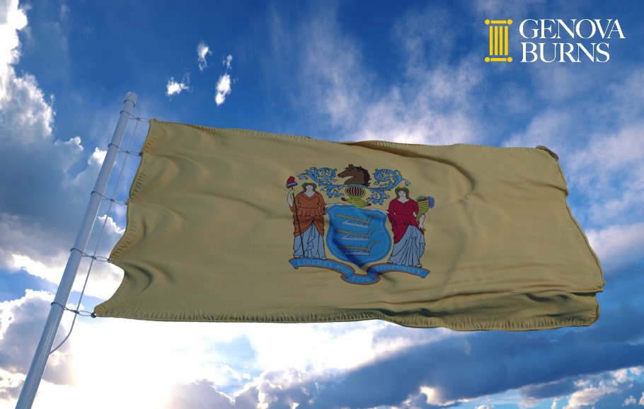 New Jersey flag on a flagpole waving in the wind blue sky background