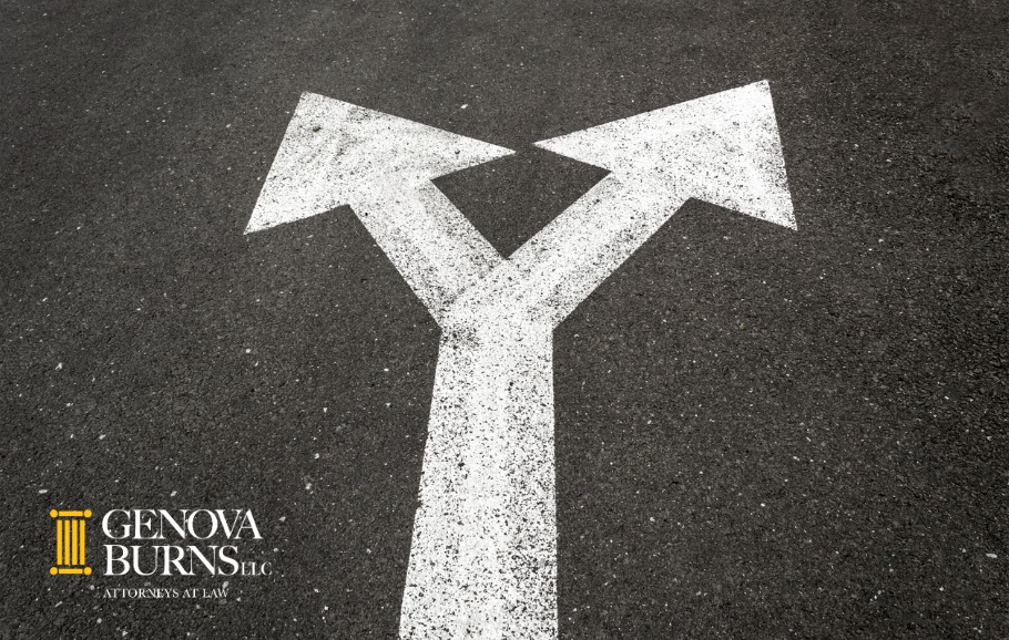 Left and right white arrows on the road