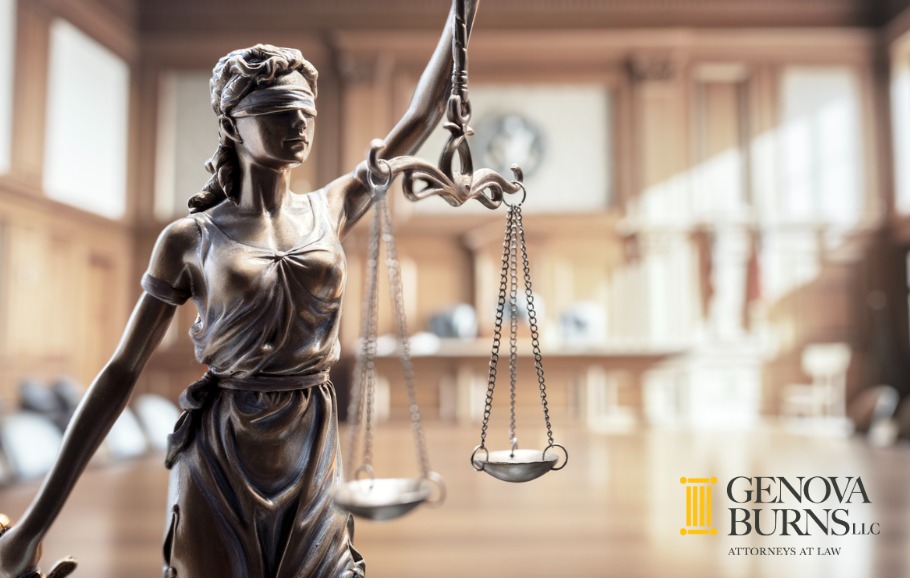 Statue of Lady Justice with scales in courtroom