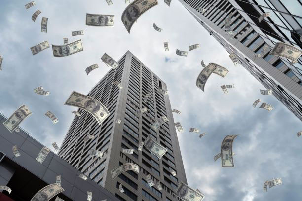 Money flying around buildings
