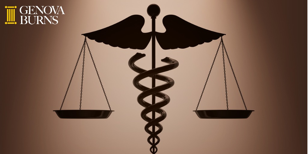 medical caduceus symbol as scales with backlight over wall